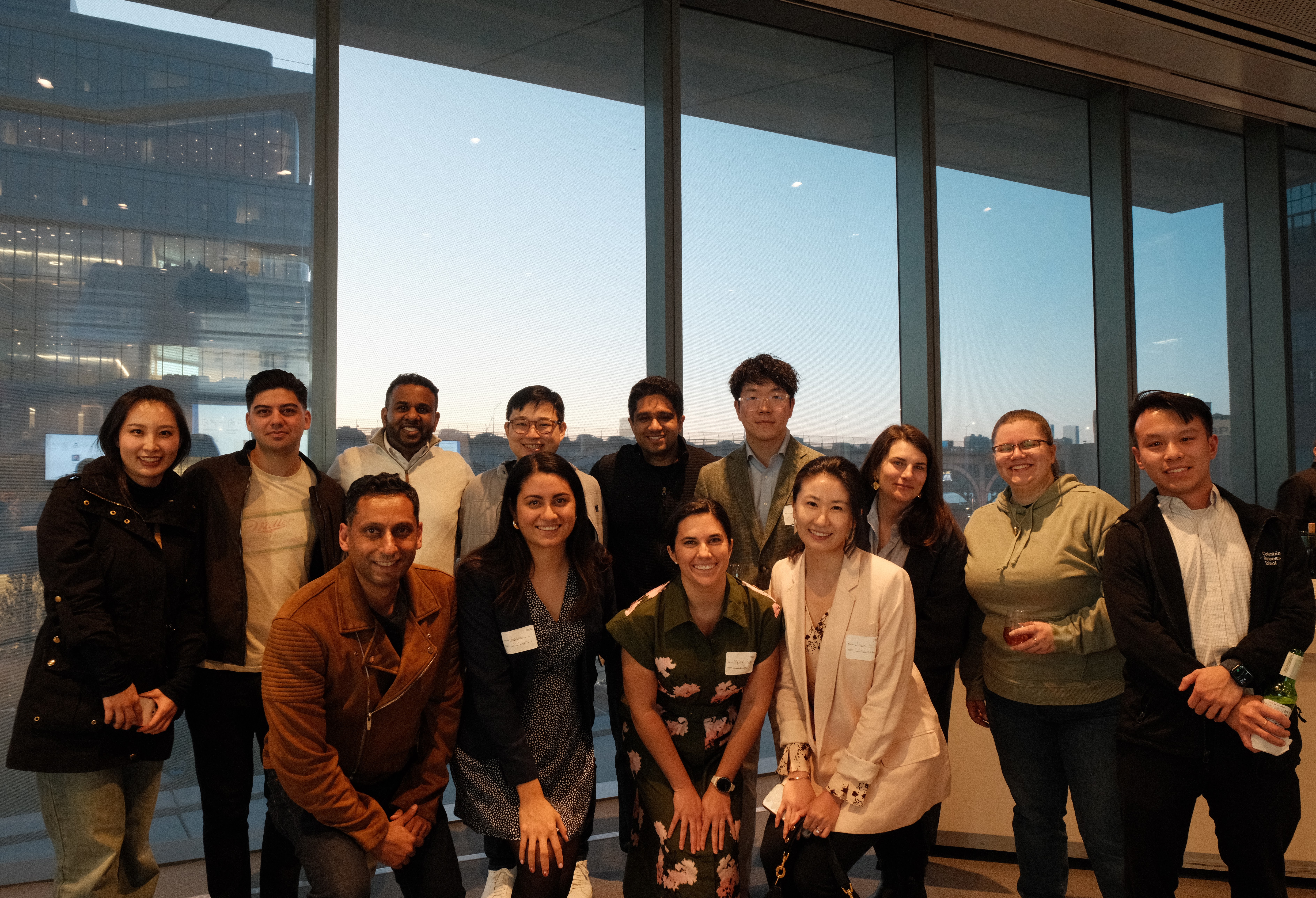 panelists with students after the AI Impact Challenge 