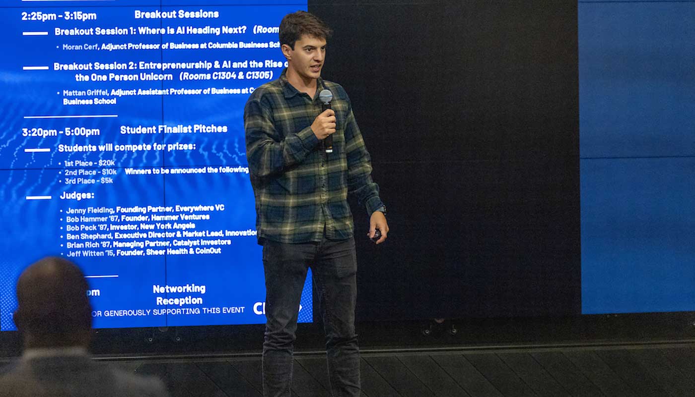 A speaker at the AI Startup Challenge addressing the crowd